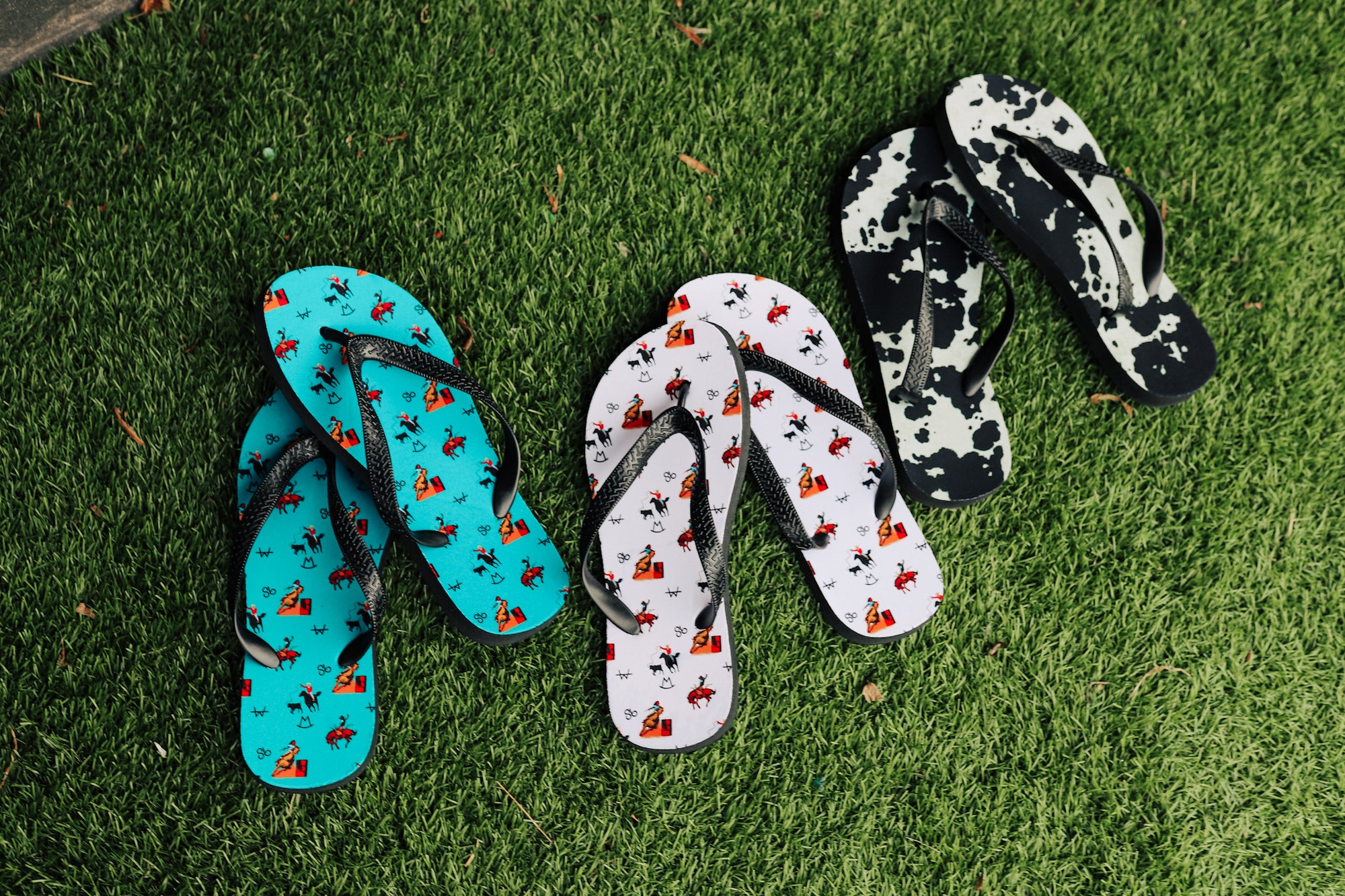 Black Cowhide Print Flip Flops